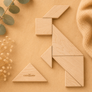 Wooden tangram puzzle on a beige surface with decorative elements
