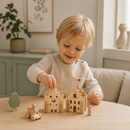 Child playing with wooden toys on a table in a cozy room.