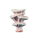 A hand-carved wooden mushroom toy with a white cap and multicolored stem, featuring a detailed and unique design.