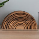 A wooden rainbow-shaped tray or organizer made of layered curved wood pieces, shown on a tabletop with dimension arrows indicating 11.4 inches wide and 5.