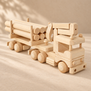 Bartu Montana wooden logging truck with six logs and folded crane, front three-quarter view.