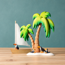 Styled display of the Bumbu Toys white sailing boat beside two wooden palm trees and four toucan figures.