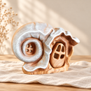 Noelino Wooden Hat House, left-side three-quarter view with the wooden door fitted.