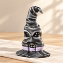 Wooden Witch Hat Fairy House by Noelino Toys, crooked black/grey hat with lilac band, two window eyes and arched doorway