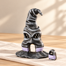 Noelino Wooden Witch Hat Fairy House with its removable door standing beside the open doorway.