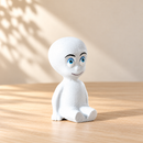 Wooden Little Ghost - Sitting by Noelino Toys, three-quarter view in a warm natural-light setting.