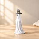 Wooden Spooky Ghost - Witch Hat Ghost by Noelino Toys, left side view in a warm natural-light setting.