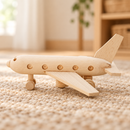 Low side view of the Bartu Sully natural wooden toy passenger plane on a warm woven rug.