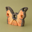 wooden butterfly house on a green background