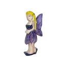 A wooden figurine of a fairy with a purple dress and yellow wings.