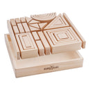 A set of wooden building blocks arranged in a nested pattern on a wooden box, including various shapes such as squares, triangles, and semi-circles.